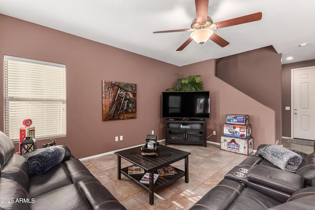 tiled living room with ceiling fan