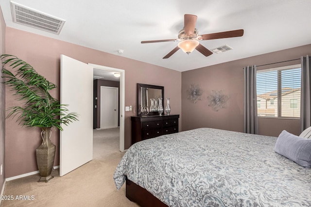 bedroom with ceiling fan and light colored carpet