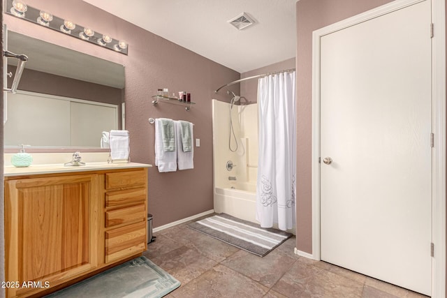 bathroom featuring lofted ceiling, shower / tub combo, and vanity