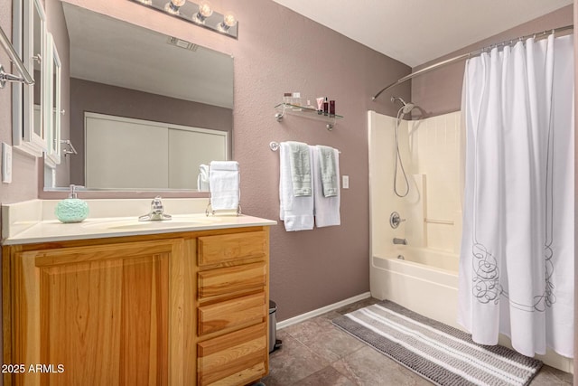 bathroom featuring vanity and shower / bath combo