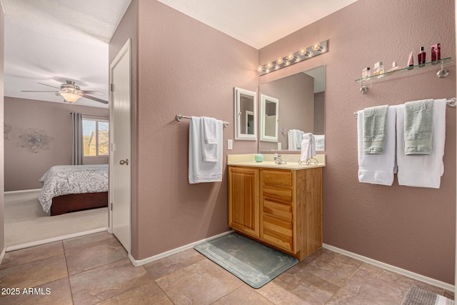 bathroom featuring ceiling fan and vanity