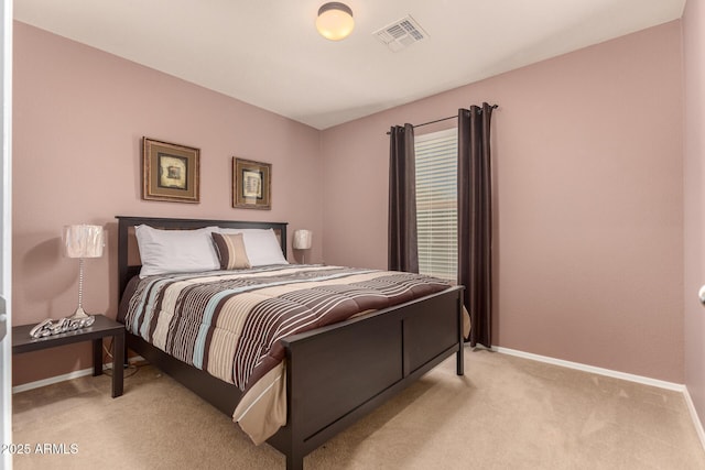 bedroom with light colored carpet