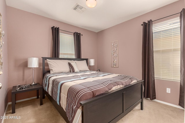 bedroom with light colored carpet