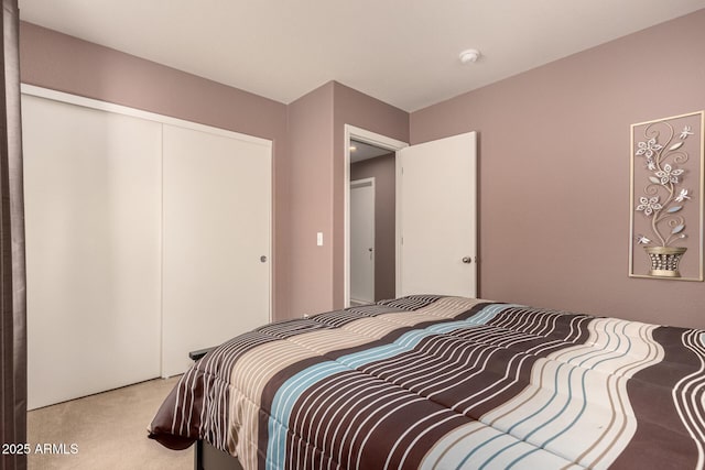 carpeted bedroom featuring a closet