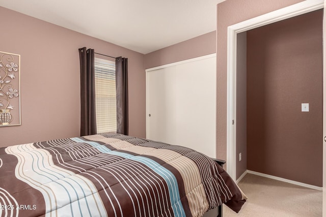 bedroom featuring a closet and carpet