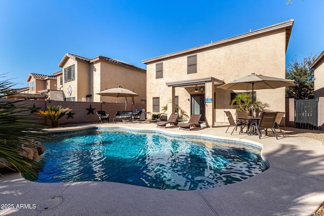 view of swimming pool with a patio area