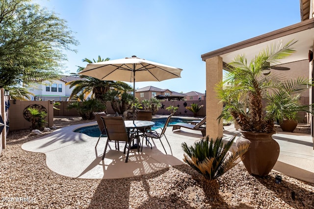 view of patio with a fenced in pool