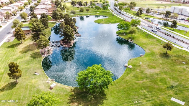 birds eye view of property with a water view