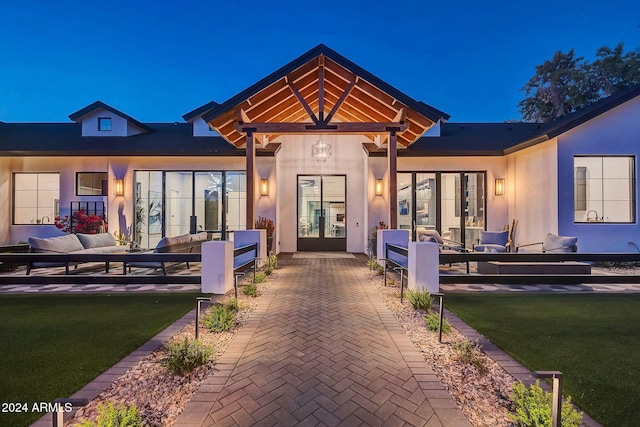 exterior space with a yard, french doors, a patio area, and an outdoor living space