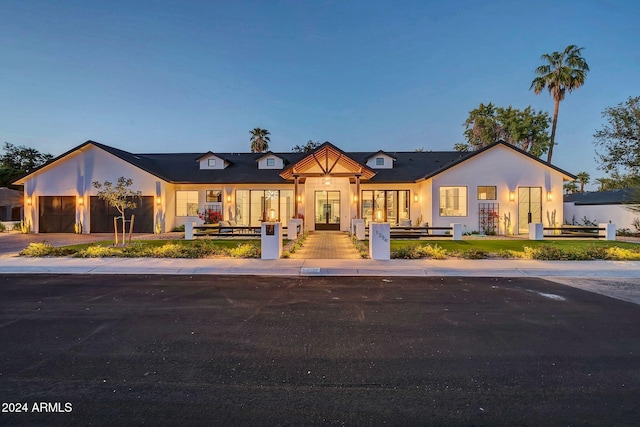 view of property with an attached garage and driveway