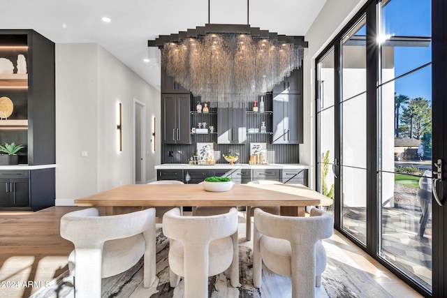 dining area featuring light wood-style floors and recessed lighting