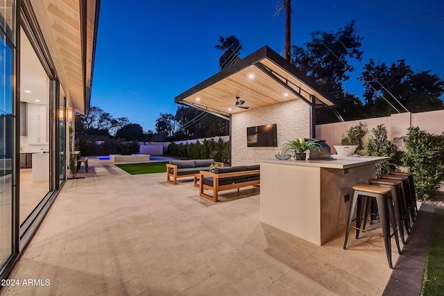 view of patio / terrace with a fenced backyard, outdoor dry bar, and outdoor lounge area