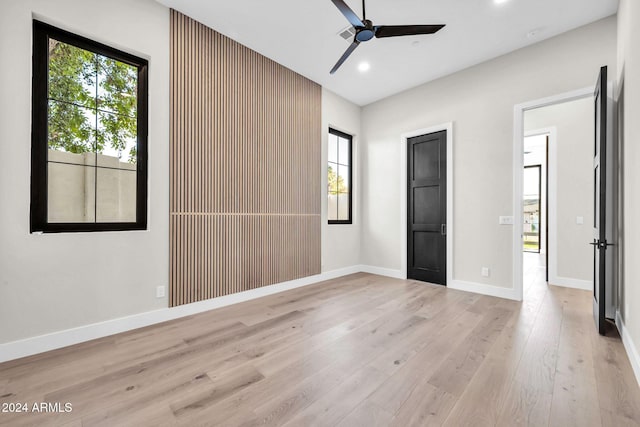 unfurnished bedroom with baseboards, ceiling fan, recessed lighting, and light wood-style floors