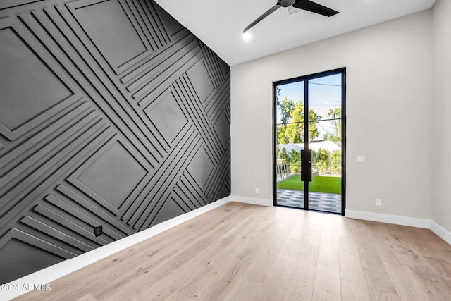 empty room featuring light hardwood / wood-style floors and ceiling fan