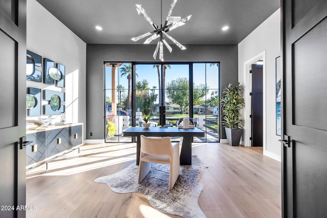 recreation room with baseboards, wood finished floors, and recessed lighting