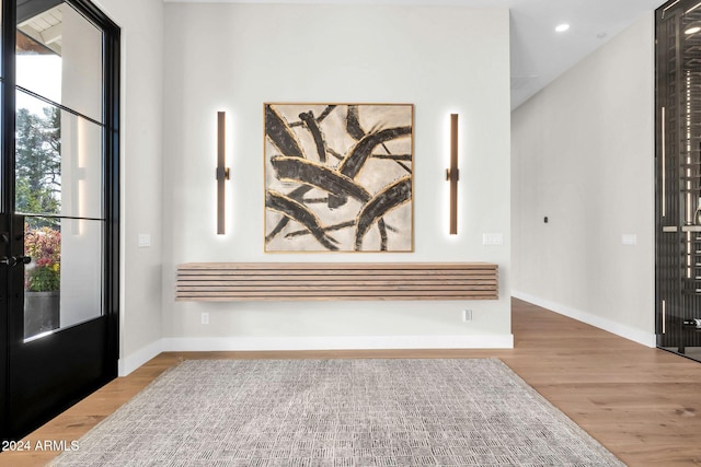 foyer entrance featuring recessed lighting, baseboards, and wood finished floors