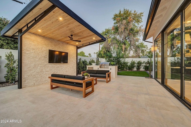 view of patio with a fenced backyard, outdoor lounge area, a ceiling fan, and area for grilling