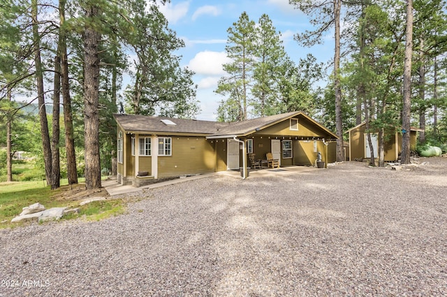 single story home featuring a carport