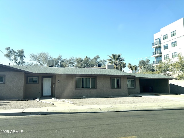 single story home featuring central AC unit