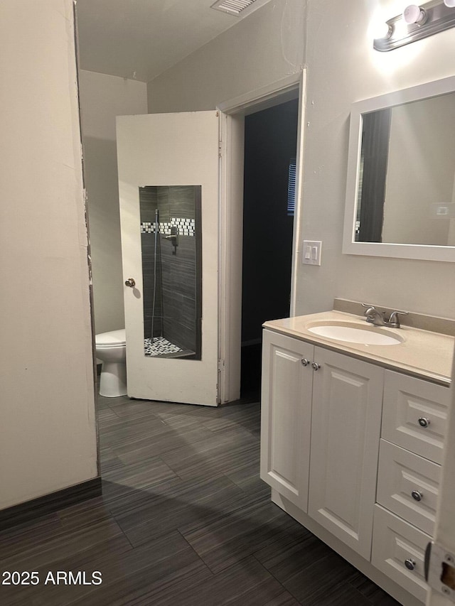 bathroom with vanity and toilet