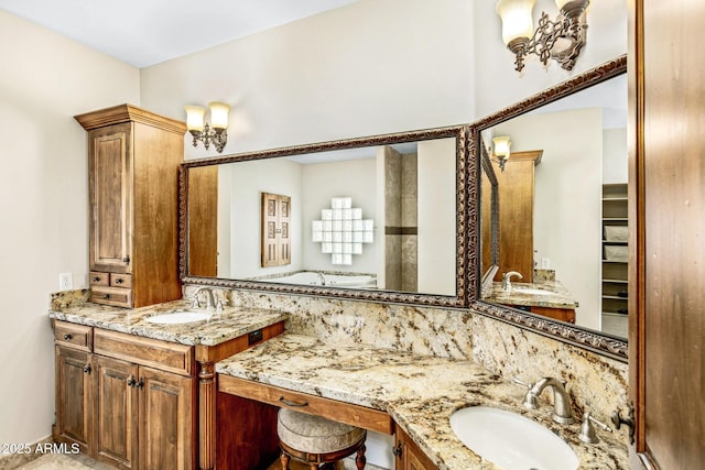 full bathroom with two vanities and a sink