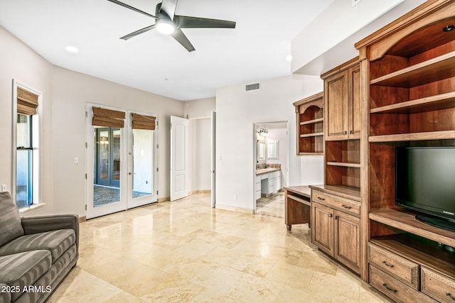 living area featuring visible vents, french doors, baseboards, and ceiling fan