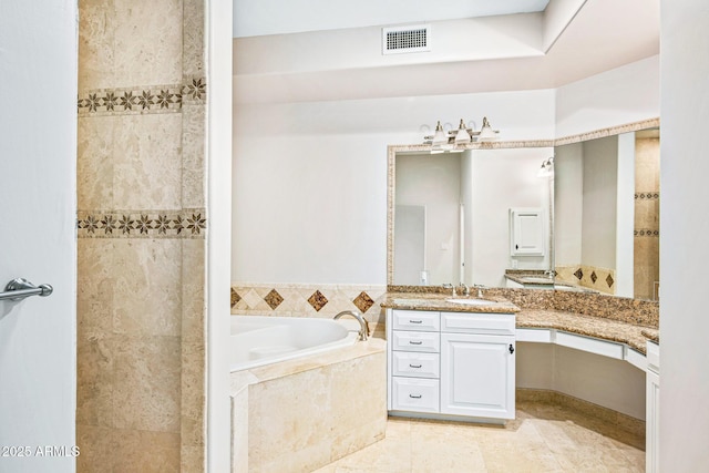 full bathroom featuring visible vents, a garden tub, a walk in shower, tile patterned flooring, and vanity