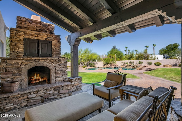 view of patio featuring a fenced in pool, fence, and an outdoor living space with a fireplace