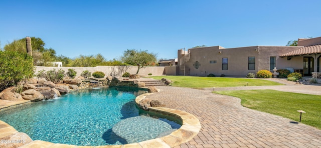 view of pool featuring a patio, a yard, fence, and a fenced in pool