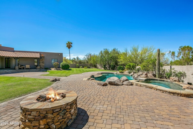 view of swimming pool featuring a fenced in pool, a patio, an in ground hot tub, and a fenced backyard