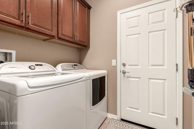 7504 W Patriot Way, Florence, AZ 85132 - laundry room featuring separate washer and dryer, cabinet space, and light tile patterned floors