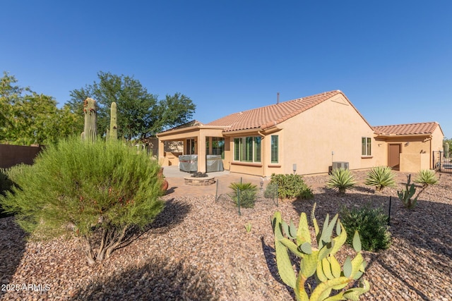 7504 W Patriot Way, Florence, AZ 85132 - back of property featuring stucco siding, a patio, and a tile roof
