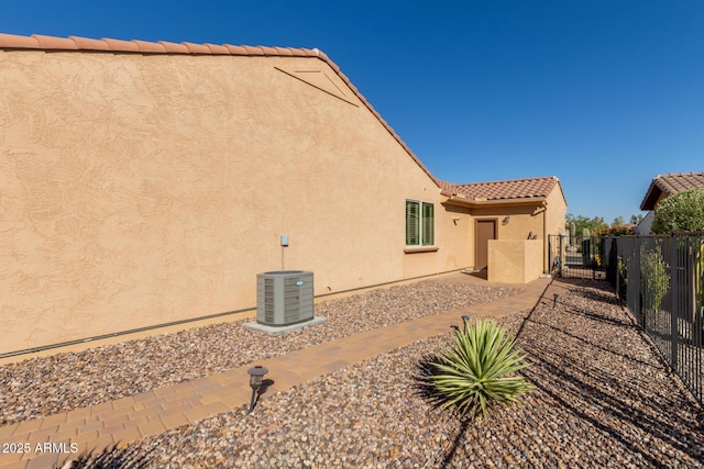 7504 W Patriot Way, Florence, AZ 85132 - view of home's exterior featuring stucco siding, a gate, and a tile roof