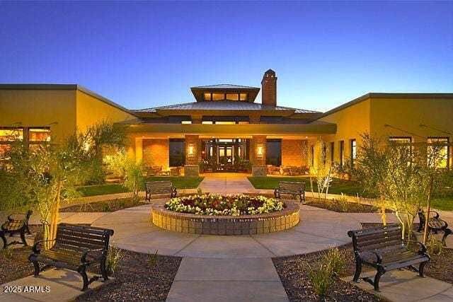 7504 W Patriot Way, Florence, AZ 85132 - back of property with a chimney and a patio area