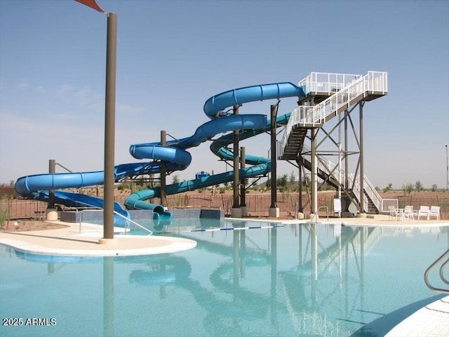 7504 W Patriot Way, Florence, AZ 85132 - community pool featuring a water slide and stairway