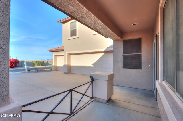 view of patio / terrace with a garage