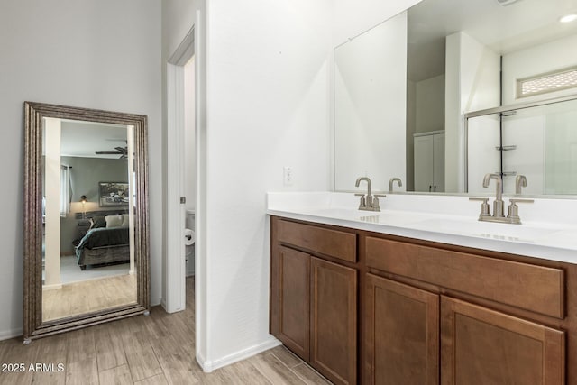 bathroom featuring vanity, hardwood / wood-style floors, and toilet