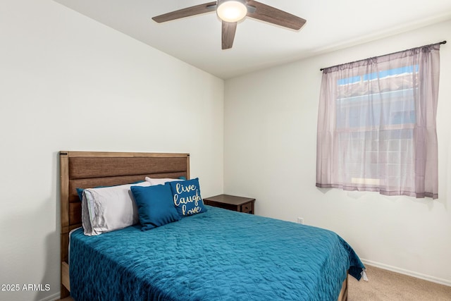 bedroom featuring ceiling fan and carpet floors