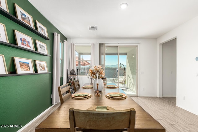 dining space featuring hardwood / wood-style flooring