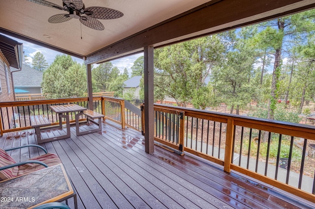 wooden terrace featuring ceiling fan