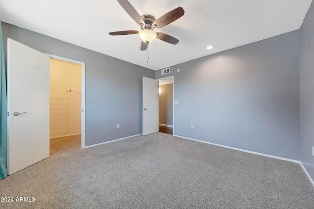 unfurnished bedroom featuring carpet and ceiling fan