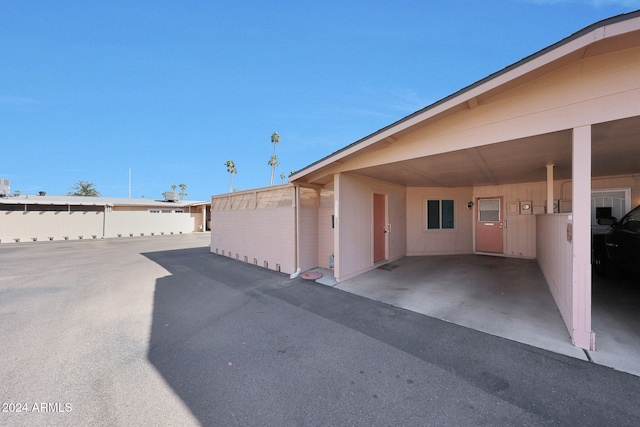 exterior space with a carport