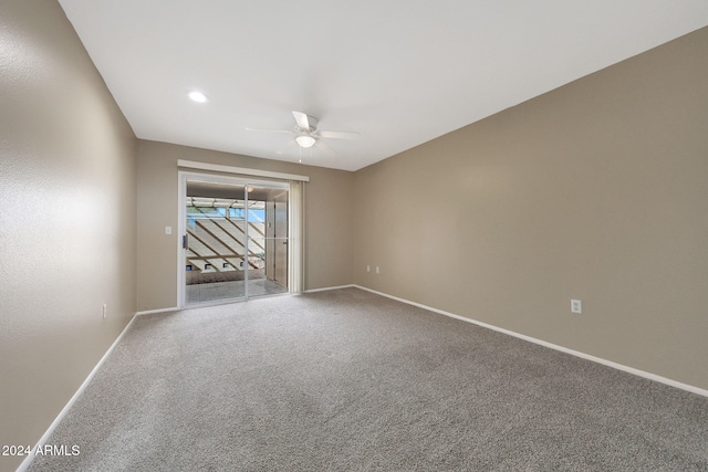 unfurnished room featuring carpet flooring and ceiling fan