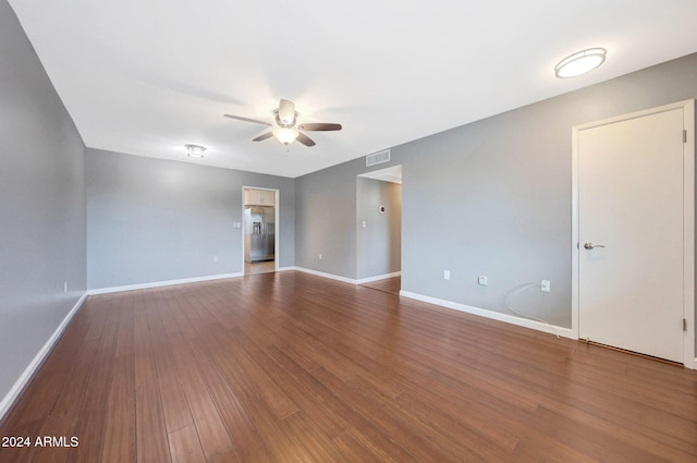 empty room featuring hardwood / wood-style flooring and ceiling fan