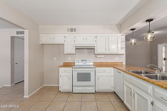 kitchen featuring a sink, white appliances, light tile patterned floors, under cabinet range hood, and visible vents