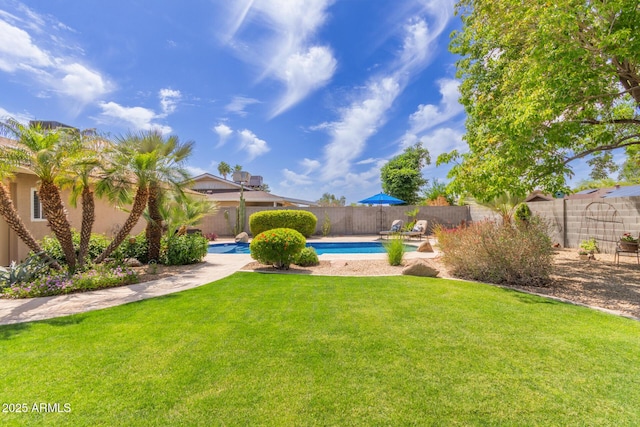 view of yard with a fenced in pool and a fenced backyard