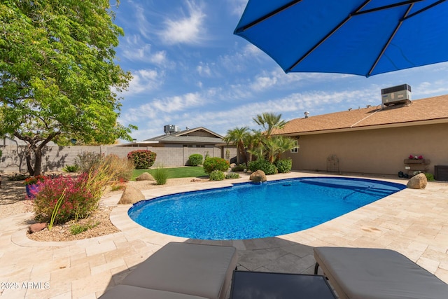view of swimming pool featuring a fenced in pool, a patio, cooling unit, and a fenced backyard