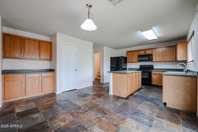 4804 S 25th Dr, Phoenix, AZ 85041 - kitchen featuring black appliances, stone tile flooring, a sink, a kitchen island, and baseboards