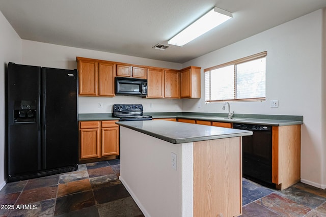 4804 S 25th Dr, Phoenix, AZ 85041 - kitchen featuring black appliances, stone tile flooring, a kitchen island, a sink, and baseboards