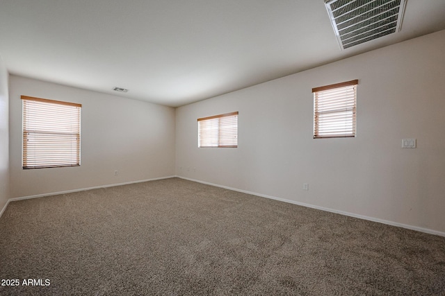 4804 S 25th Dr, Phoenix, AZ 85041 - empty room featuring carpet flooring, healthy amount of natural light, and baseboards